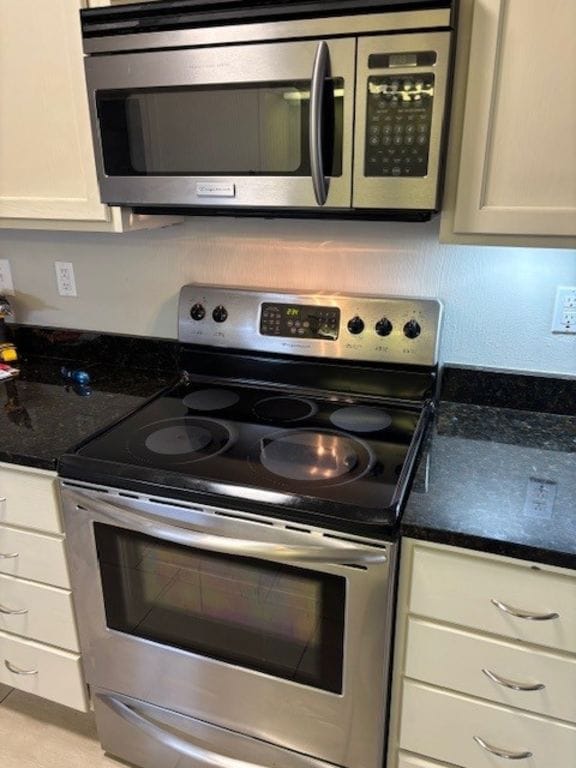 307 Quarry St, San Marcos, TX 78666 - kitchen with stainless steel appliances and white cabinetry