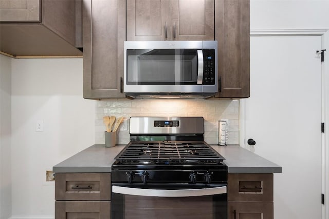 2012 Mimosa Trl, Round Rock, TX 78664 - kitchen featuring stainless steel appliances, backsplash, and dark brown cabinetry