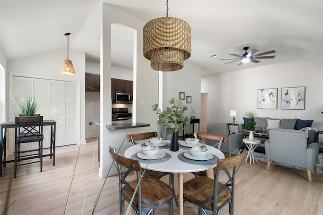 2012 Mimosa Trl, Round Rock, TX 78664 - dining area featuring lofted ceiling, light wood finished floors, and a ceiling fan