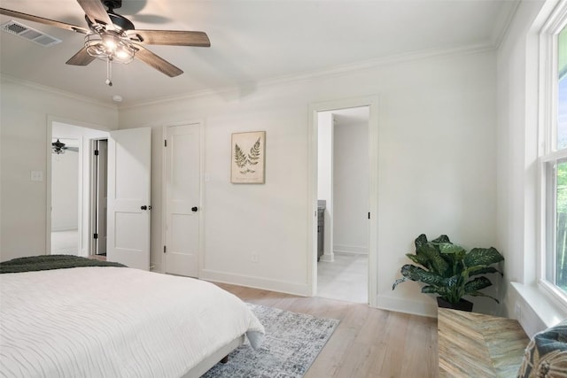 2012 Mimosa Trl, Round Rock, TX 78664 - bedroom featuring light wood-style floors, ornamental molding, baseboards, and ceiling fan
