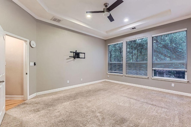 2607 Deep River Cir, Round Rock, TX 78665 - spare room featuring ceiling fan, a tray ceiling, carpet, and recessed lighting