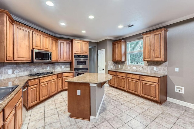 2607 Deep River Cir, Round Rock, TX 78665 - kitchen featuring stainless steel appliances, crown molding, decorative backsplash, recessed lighting, and brown cabinetry