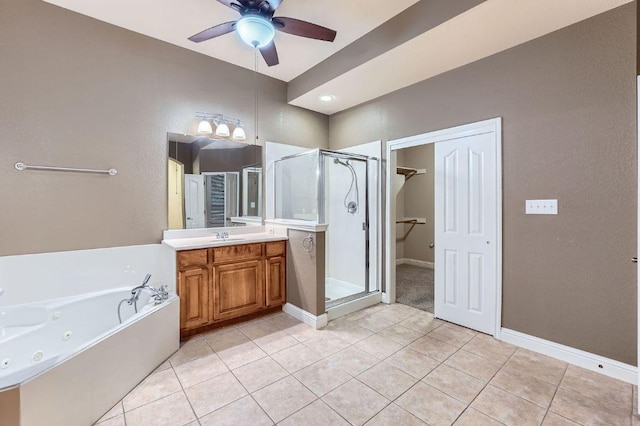 2607 Deep River Cir, Round Rock, TX 78665 - bathroom with a stall shower, tile patterned floors, a tub with jets, vanity, and ceiling fan