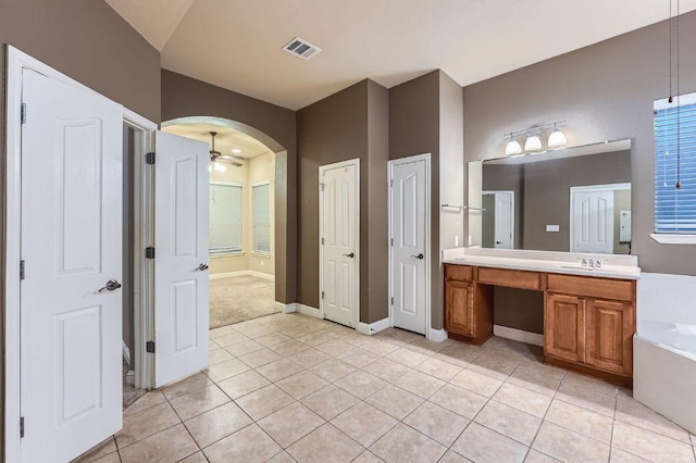 2607 Deep River Cir, Round Rock, TX 78665 - bathroom featuring vanity, tile patterned flooring, a tub, and a ceiling fan