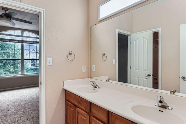 2607 Deep River Cir, Round Rock, TX 78665 - bathroom featuring double vanity and a ceiling fan