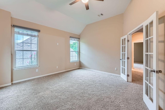 2607 Deep River Cir, Round Rock, TX 78665 - empty room with french doors, a ceiling fan, carpet, and vaulted ceiling