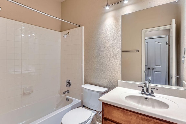2607 Deep River Cir, Round Rock, TX 78665 - bathroom with a textured wall, vanity, and bathtub / shower combination
