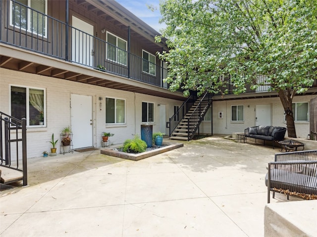 1503 W 9th St Unit 204, Austin, TX 78703 - view of patio / terrace with an outdoor hangout area and stairway