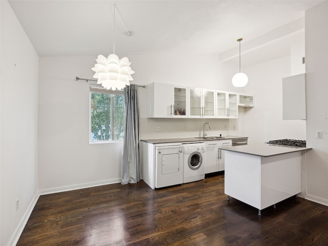 1503 W 9th St Unit 204, Austin, TX 78703 - kitchen with a sink, a chandelier, lofted ceiling, white cabinetry, and glass insert cabinets