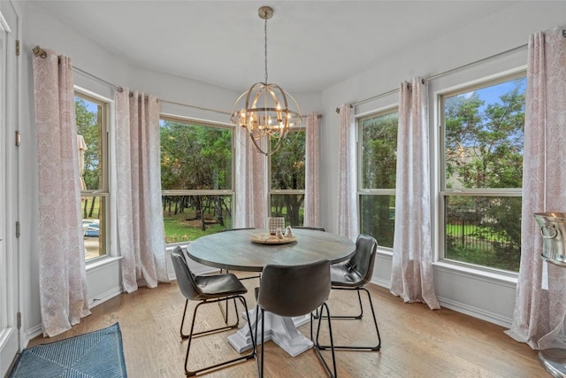 1626 Bearkat Canyon Dr, Dripping Springs, TX 78620 - dining space with a chandelier and light wood finished floors