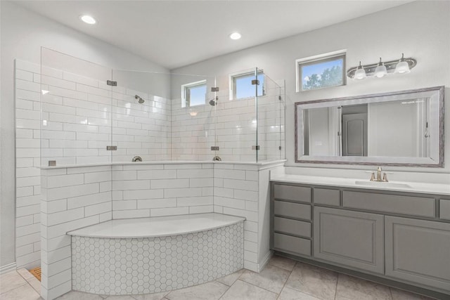 1626 Bearkat Canyon Dr, Dripping Springs, TX 78620 - bathroom with a tile shower, vanity, tile patterned floors, and recessed lighting