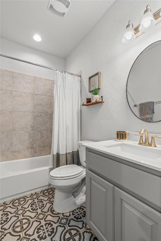 1626 Bearkat Canyon Dr, Dripping Springs, TX 78620 - full bathroom featuring vanity, shower / tub combo, tile patterned flooring, and recessed lighting