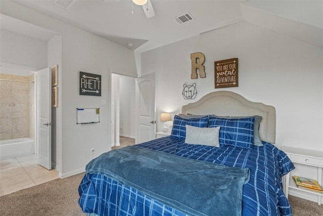 1626 Bearkat Canyon Dr, Dripping Springs, TX 78620 - carpeted bedroom with a ceiling fan, lofted ceiling, tile patterned flooring, and ensuite bathroom