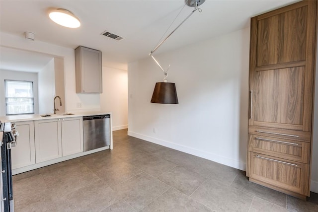 7022 Hillcroft Dr, Austin, TX 78724 - kitchen with appliances with stainless steel finishes, a sink, light countertops, baseboards, and light tile patterned flooring