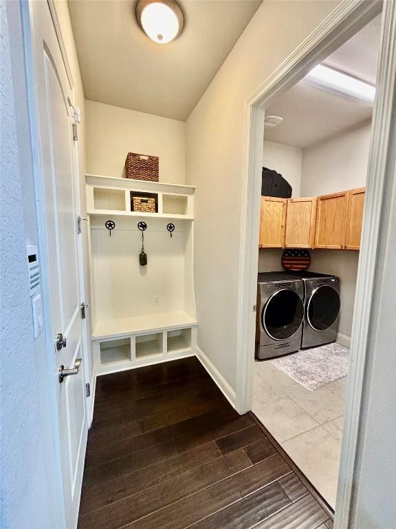 707 Mendocino Ln, Austin, TX 78737 - mudroom featuring washing machine and dryer, dark wood finished floors, and baseboards