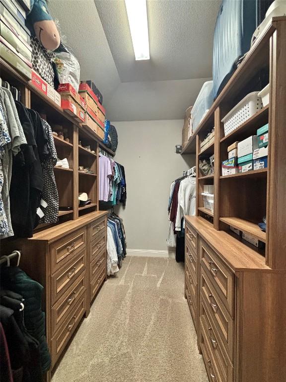 707 Mendocino Ln, Austin, TX 78737 - spacious closet with light colored carpet and vaulted ceiling