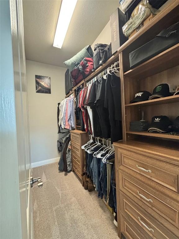 707 Mendocino Ln, Austin, TX 78737 - walk in closet featuring carpet