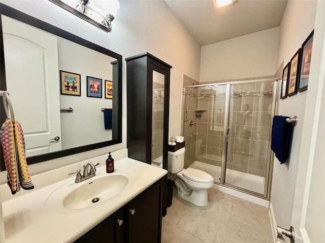 707 Mendocino Ln, Austin, TX 78737 - full bathroom with toilet, a shower stall, vanity, and tile patterned floors