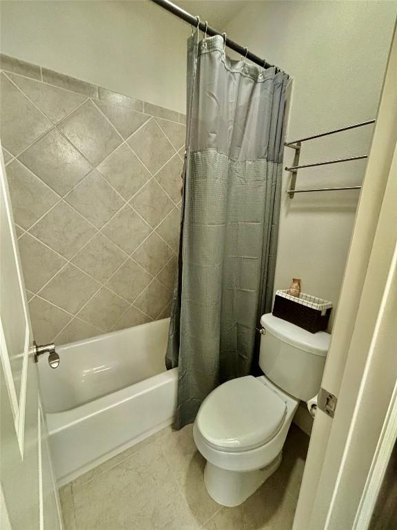 707 Mendocino Ln, Austin, TX 78737 - full bath featuring shower / tub combo, toilet, and tile patterned flooring