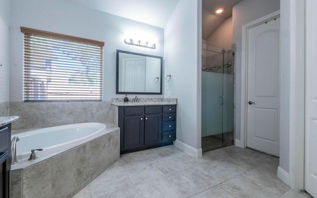 707 Mendocino Ln, Austin, TX 78737 - bathroom featuring vanity, a garden tub, a shower stall, and tile patterned flooring