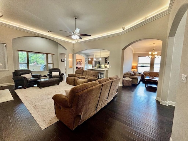 707 Mendocino Ln, Austin, TX 78737 - living area featuring arched walkways, a ceiling fan, plenty of natural light, a chandelier, and crown molding