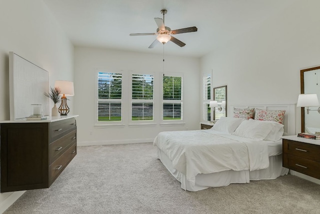119 Loysoya St, Bastrop, TX 78602 - bedroom featuring multiple windows, light colored carpet, a ceiling fan, and baseboards