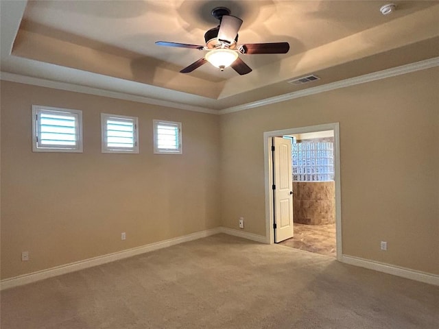 5041 Big Bend Trl, Georgetown, TX 78633 - unfurnished room with a tray ceiling, light colored carpet, crown molding, ceiling fan, and a smoke detector