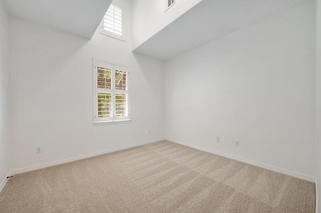 6201 River Place Blvd Unit 4, Austin, TX 78730 - unfurnished room with light colored carpet, healthy amount of natural light, and a towering ceiling