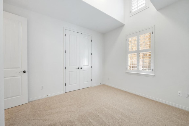 6201 River Place Blvd Unit 4, Austin, TX 78730 - unfurnished bedroom featuring carpet, multiple windows, and a closet