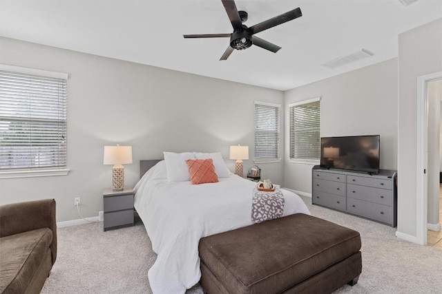 1017 Sussex Way, Round Rock, TX 78665 - carpeted bedroom with baseboards and a ceiling fan