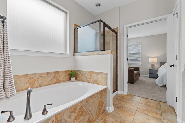 1017 Sussex Way, Round Rock, TX 78665 - full bath with a bath, a stall shower, ensuite bathroom, tile patterned flooring, and baseboards