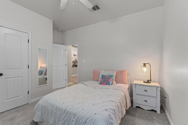1017 Sussex Way, Round Rock, TX 78665 - bedroom with light carpet, baseboards, and a ceiling fan