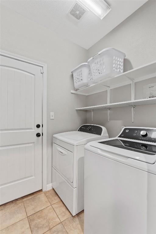 1017 Sussex Way, Round Rock, TX 78665 - laundry room featuring separate washer and dryer and light tile patterned floors