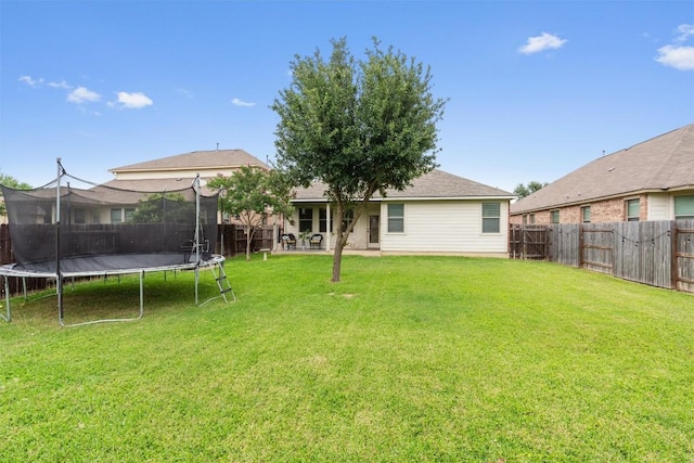 1017 Sussex Way, Round Rock, TX 78665 - back of property featuring a trampoline