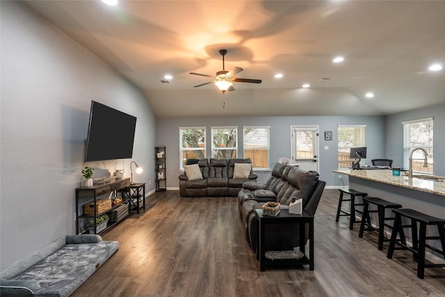 2612 American Dr, Lago Vista, TX 78645 - living room featuring vaulted ceiling, ceiling fan, plenty of natural light, baseboards, and dark wood-style floors