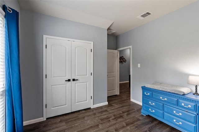 2612 American Dr, Lago Vista, TX 78645 - unfurnished bedroom featuring dark wood-style floors, a closet, and baseboards