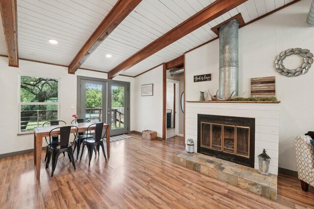 360 Little Barton Dr, Dripping Springs, TX 78620 - dining space featuring wood finished floors, a glass covered fireplace, baseboards, french doors, and wood ceiling