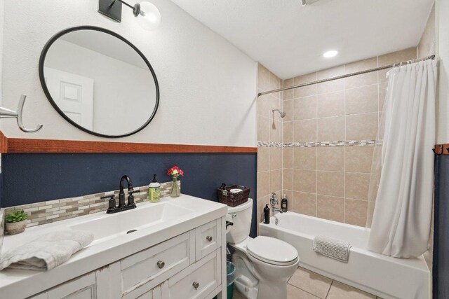 360 Little Barton Dr, Dripping Springs, TX 78620 - bathroom featuring toilet, vanity, shower / bath combo, tile patterned floors, and backsplash