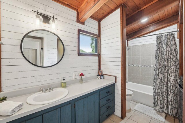 360 Little Barton Dr, Dripping Springs, TX 78620 - bathroom featuring wood ceiling with exposed beams, tile patterned floors, wooden walls, vanity, and toilet