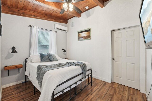 360 Little Barton Dr, Dripping Springs, TX 78620 - bedroom with an AC wall unit, wooden ceiling with exposed beams, wood finished floors, and baseboards
