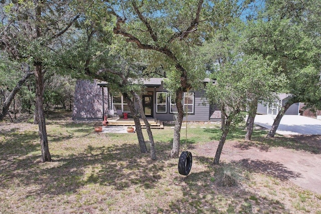 360 Little Barton Dr, Dripping Springs, TX 78620 - view of property hidden behind natural elements with a front lawn