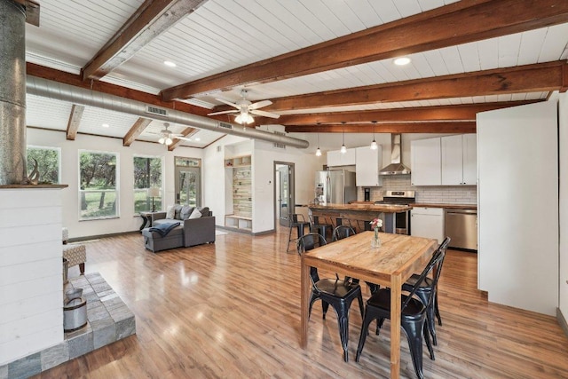 360 Little Barton Dr, Dripping Springs, TX 78620 - dining room with a ceiling fan, light wood-type flooring, and beam ceiling