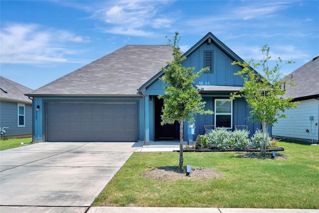 225 Sweetwater Creek Ln, Hutto, TX 78634 - ranch-style house featuring an attached garage, board and batten siding, concrete driveway, and a front yard