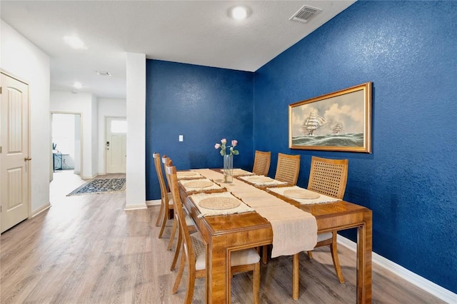225 Sweetwater Creek Ln, Hutto, TX 78634 - dining space with wood finished floors and baseboards