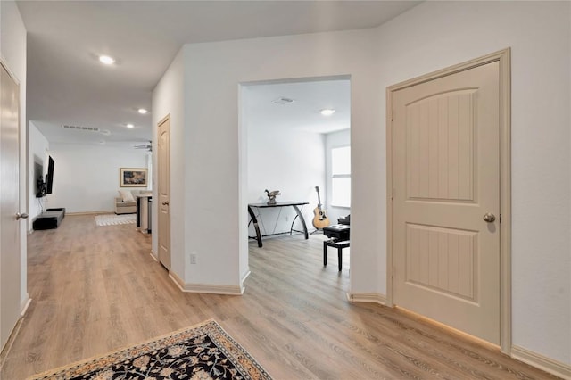 225 Sweetwater Creek Ln, Hutto, TX 78634 - hallway featuring light wood-type flooring, baseboards, and recessed lighting