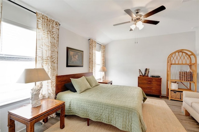 225 Sweetwater Creek Ln, Hutto, TX 78634 - bedroom featuring light wood finished floors, lofted ceiling, and ceiling fan