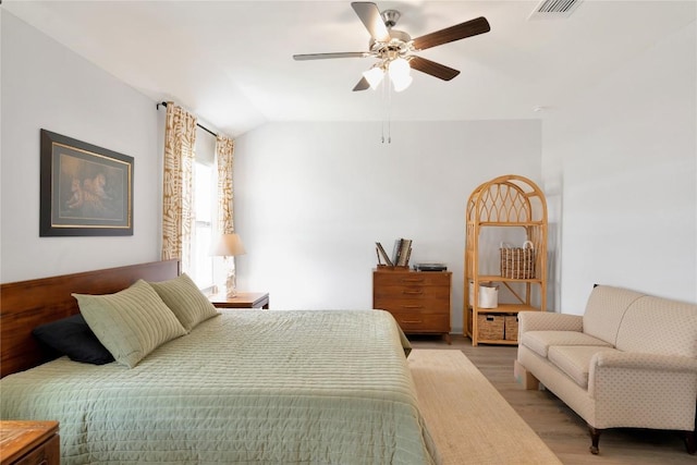 225 Sweetwater Creek Ln, Hutto, TX 78634 - bedroom with light wood-style floors, vaulted ceiling, and a ceiling fan