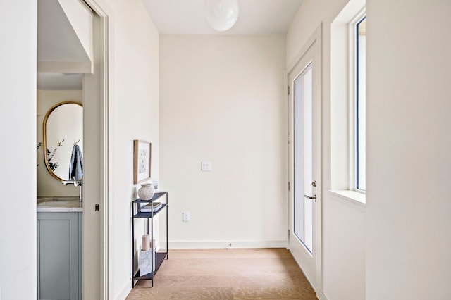 2403 E 22nd St, Austin, TX 78722 - hall featuring light wood-style floors and baseboards