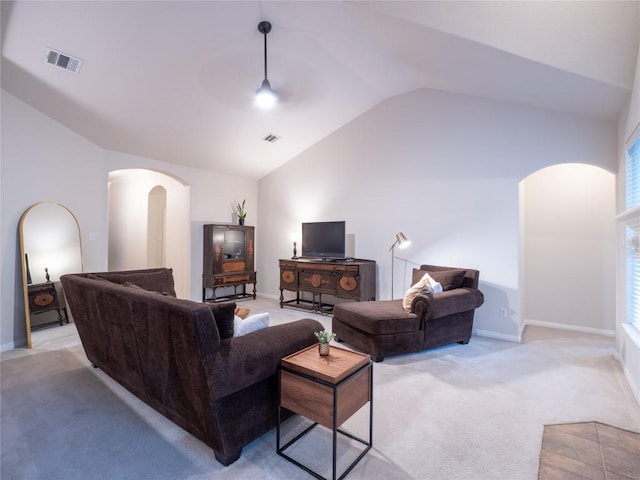 2214 Yellow Bird Trl, Austin, TX 78734 - living area with arched walkways, light carpet, lofted ceiling, and a ceiling fan