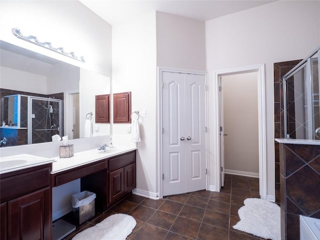 2214 Yellow Bird Trl, Austin, TX 78734 - full bath featuring double vanity, a shower stall, and tile patterned floors